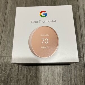 Google Nest Thermostat in White and Gold